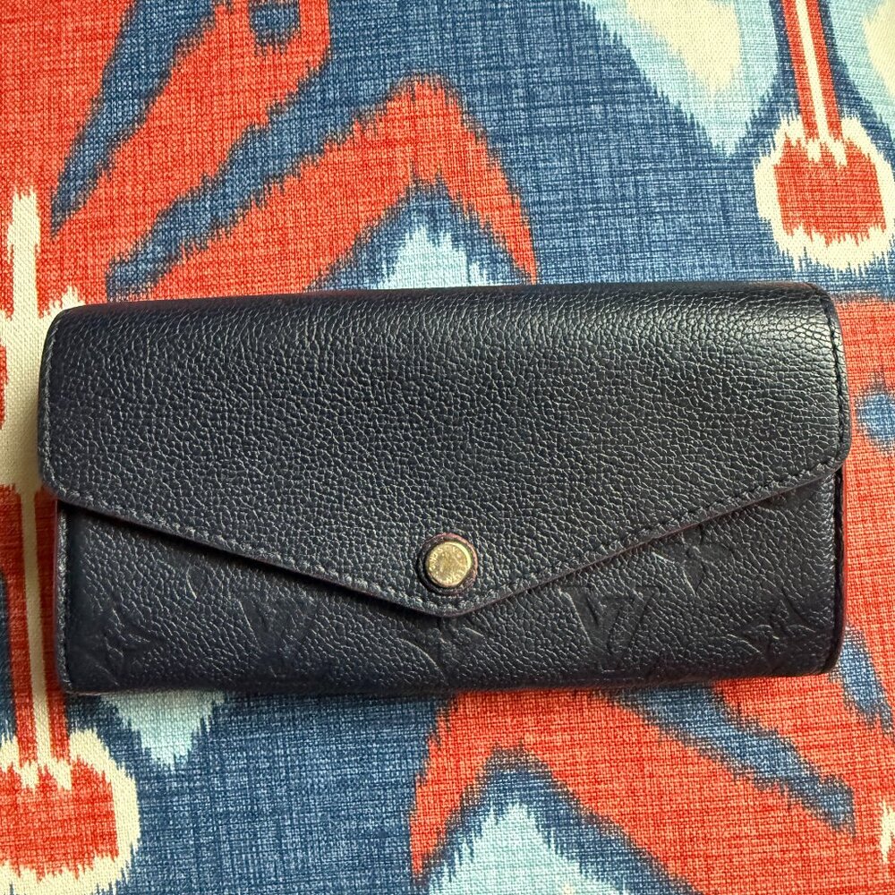 Classic Louis Vuitton long wallet in Gorgeous Navy with Red edges